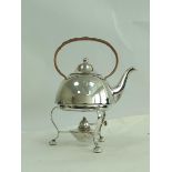E.p. tea kettle of hemispherical shape, with stand and lamp.