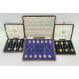 Two sets of six silver coffee spoons with bean ends and another twelve, cased.