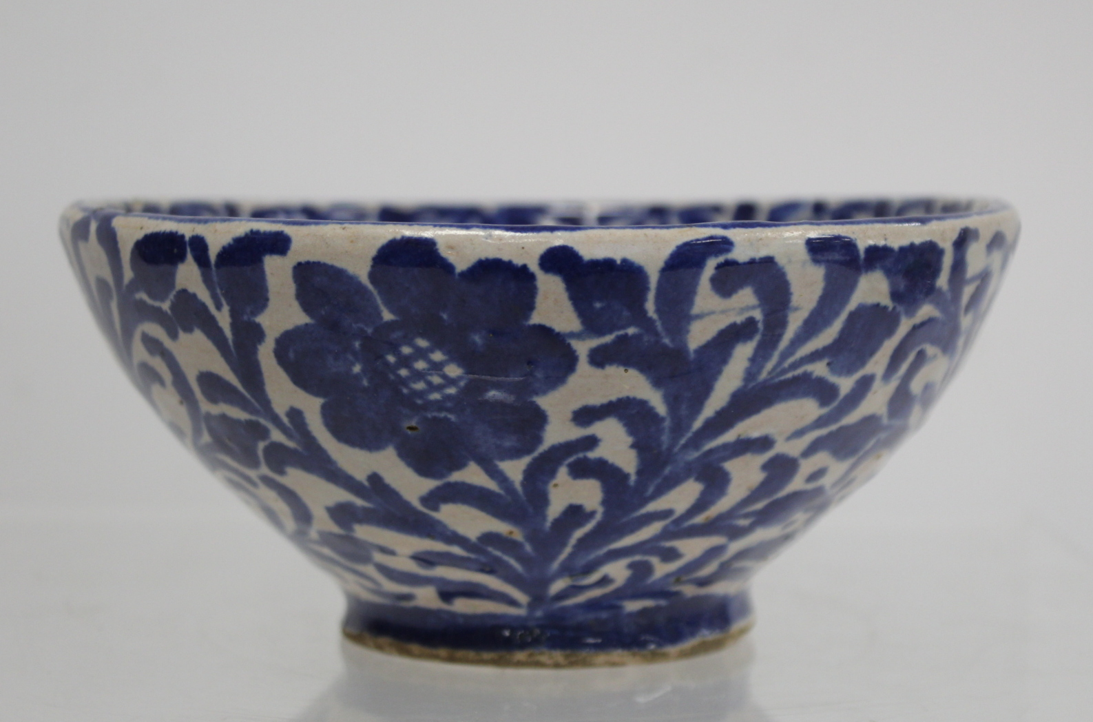 Middle Eastern small earthenware blue and white circular bowl decorated with stylised flowers and - Image 10 of 12