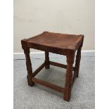 Robert "Mouseman" Thompson, oak stool with rectangular hide top on faceted turned support with