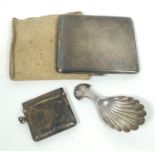 Silver scallop caddy spoon, Britannia Standard, Birmingham 1911, a vesta case and a cigarette