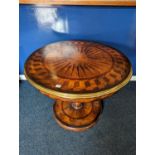 A modern centre table with circular parquetry top with bass edge on barley twist support on circular