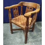 Robert "Mouseman" Thompson, "monk's" oak tub armchair, the top rail terminating in carved