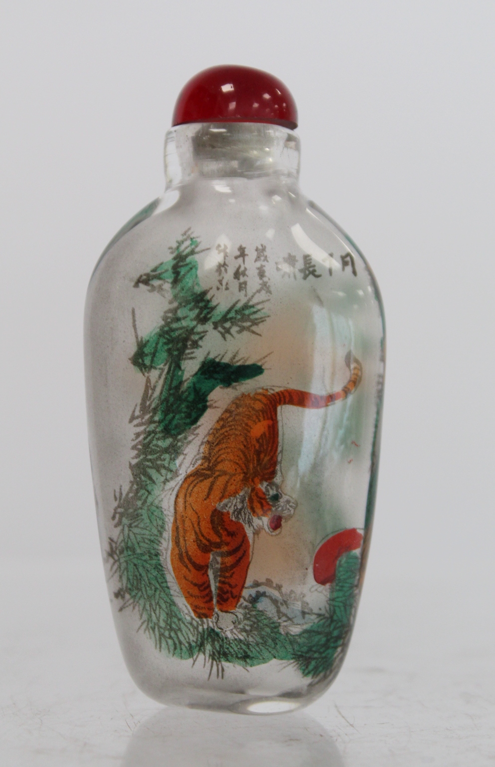 Chinese glass snuff bottle of flattened ovoid form internally decorated with figures of two tigers