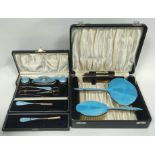 Silver hairbrush and mirror with guilloche enamel, 1936 and a similar manicure set, both cased.
