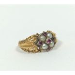 Early Victorian garnet and pearl ring in engraved gold, probably 15ct.