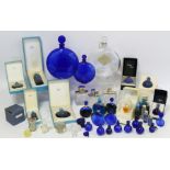 Collection of various Lalique perfume bottles including Worth "Je Reviens" and "Dans la Nuit",