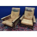 Robert "Mouseman" Thompson, pair of oak easy chairs upholstered in worn hide, with adjustable