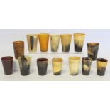 Collection of fourteen horn beakers, the largest 8.5cm high, the smallest 7cm high.  (14).