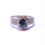 Diamond and sapphire oval cluster ring with eight-cut brilliants, in 18ct white gold, 1973, size