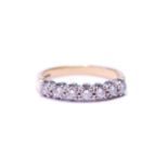Diamond seven-stone half eternity ring with brilliants, approximately .05ct, in 18ct gold, size L,