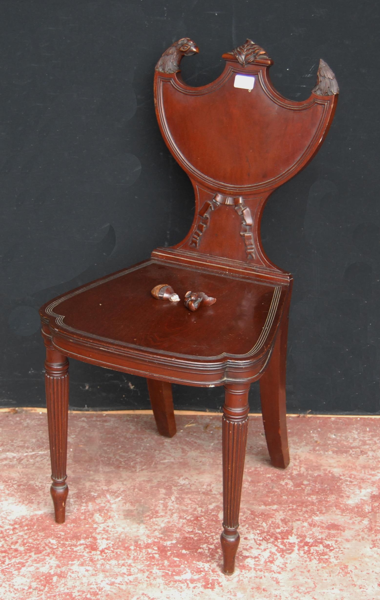 19th century mahogany hall chair by Gillows of Lancaster, with eagle surmounts to the the shield-