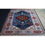 Turkish rug decorated with a large geometric medallion to the centre, guls and further geometric