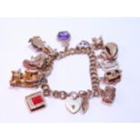 Gold bracelet with 9ct and other charms dependant, 50g gross.