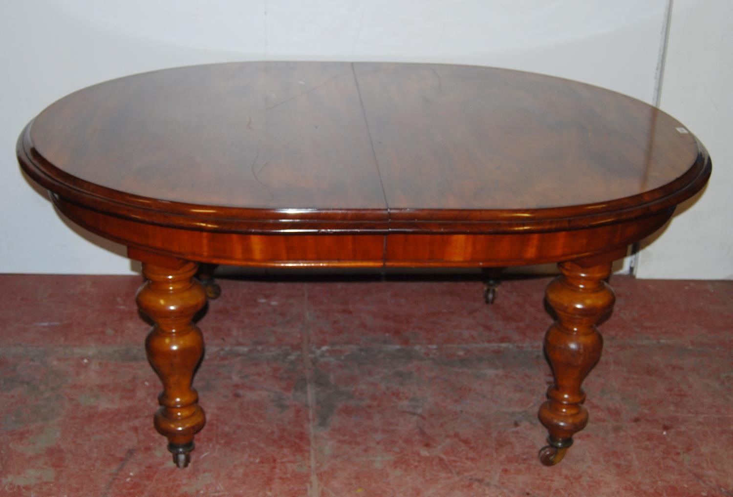 Victorian mahogany extending D-end dining table, on turned supports with castors, 71cm high, 167cm