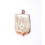 Victorian gold locket of shield shape, probably 18ct gold, 11g.