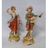 Pair of Royal Dux figures modelled as a young gentleman in 18th century-style garb playing a lute,