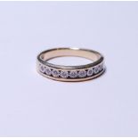 9ct gold diamond illusion-set ring set with nine small brilliants, stamped '9k', size J, 2.8g gross.