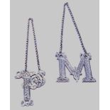 Pair of silver initial spirit labels, 'M' and 'P', elaborately chased and pierced, by Marshall &