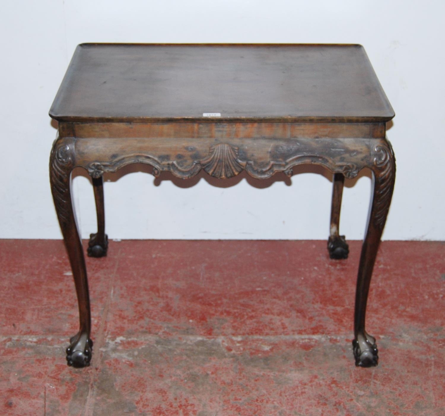 Antique mahogany silver table in the manner of Thomas Chippendale, the rectangular top with canted