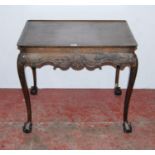 Antique mahogany silver table in the manner of Thomas Chippendale, the rectangular top with canted