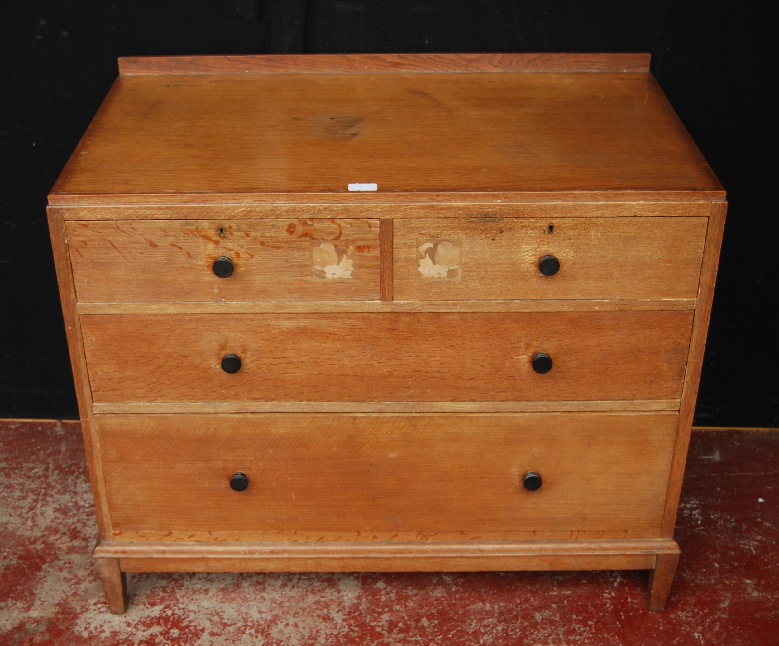 1920s oak chest of drawers in the manner of Heal's of London, with two short drawers, each with a