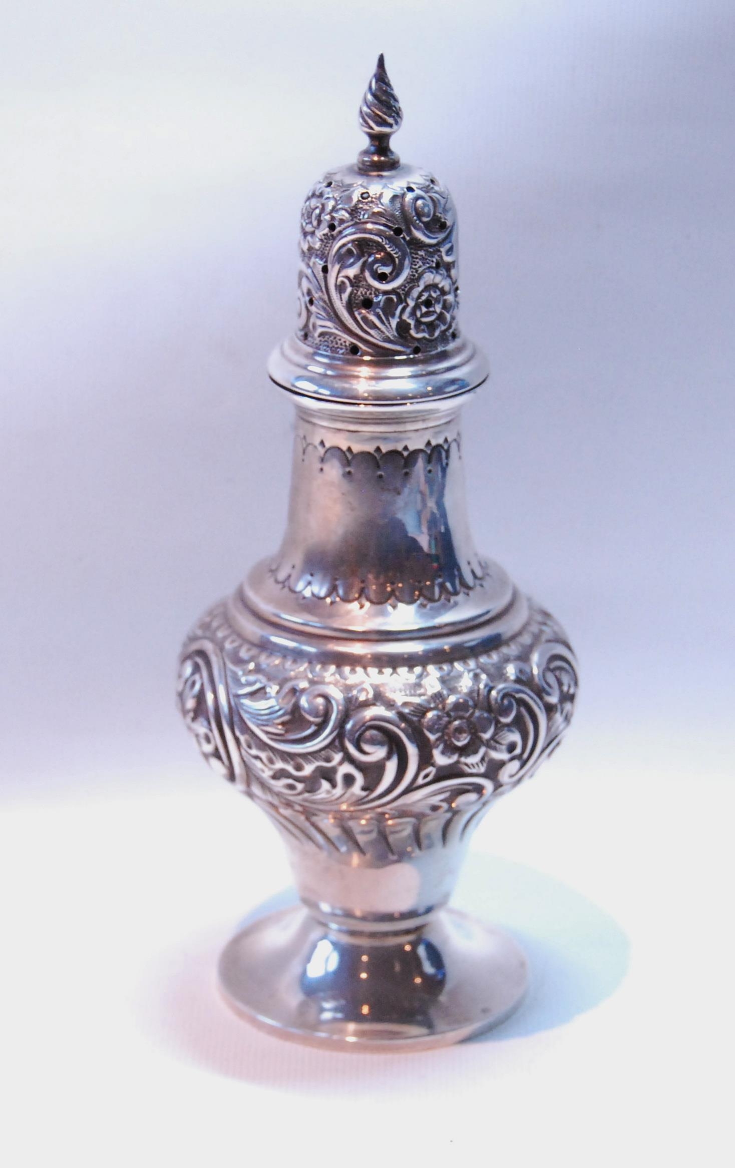 Silver baluster caster embossed with scrolls, Birmingham 1903, 136g or 4oz.