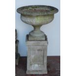 Composition garden campagna urn of large form, on a fixed circular foot and plinth base, on