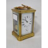 Brass repeater carriage clock with subsidiary seconds dial, with key, 12cm high.