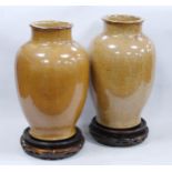 Pair of Chinese Qianlong revival earthenware vases, crackle glazed in muted colours, 31cm high, on