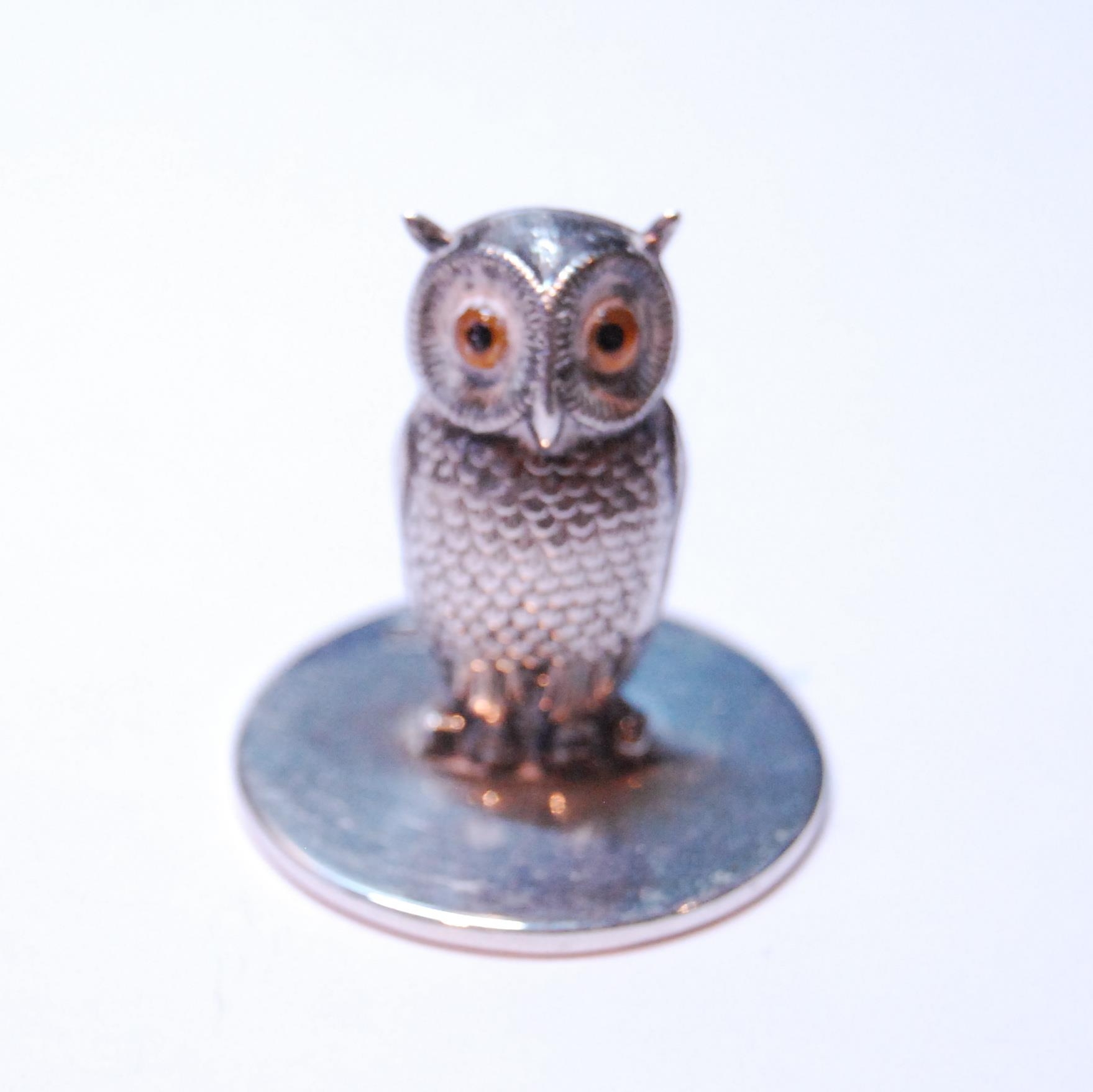 Silver menu holder modelled as an owl with glass eyes, on a disc base, by S Mordan, Chester 1905,