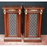 Pair of Regency-style rosewood veneered cabinets, each with a faux door flanked by cylindrical