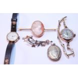 Two ladies' gold watches, a cameo pin, locket and a pearl openwork brooch.  (5)