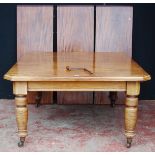 Late Victorian mahogany extending dining table with three additional leaves, on baluster legs with