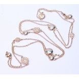 Diamond necklace with ten flattened beads in sizes, some pave-set with tiny diamond brilliants, in