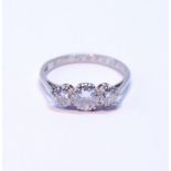 Diamond three-stone ring, the brilliants approximately .7ct and .4ct, in platinum, dated 1933,