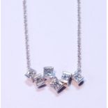 Diamond pendant with six randomly-set rectangular diamond brilliants, in 18ct white gold.