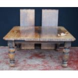 Oak extending dining table, c. early 20th century, with two additional leaves, with incised