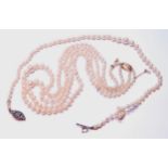 Two-row graduated cultured pearl necklace on 9ct gold snap, and another, single row.