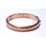 9ct gold hinged bangle, half engraved and inscribed, 1969, 15.5g.