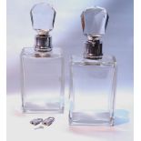 Pair of Edwardian heavy cut glass lockable spirit decanters, plain rectangular, with faceted