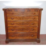 19th century mahogany chest of five long graduated drawers with turned handles, flanked by