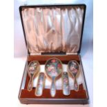 Unusual frosted silver gilt six-piece toilet set painted with vases of flowers and similar sprays,