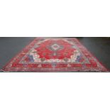 Large Persian Keshan carpet with a large medallion to the centre within all over floral medallions