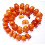 Amber bead necklace of variegated circular beads, 146g.