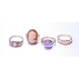 Cameo ring, another, cabochon amethyst, 1978, another, opal, and a knot ring, all 9ct gold.  (4)