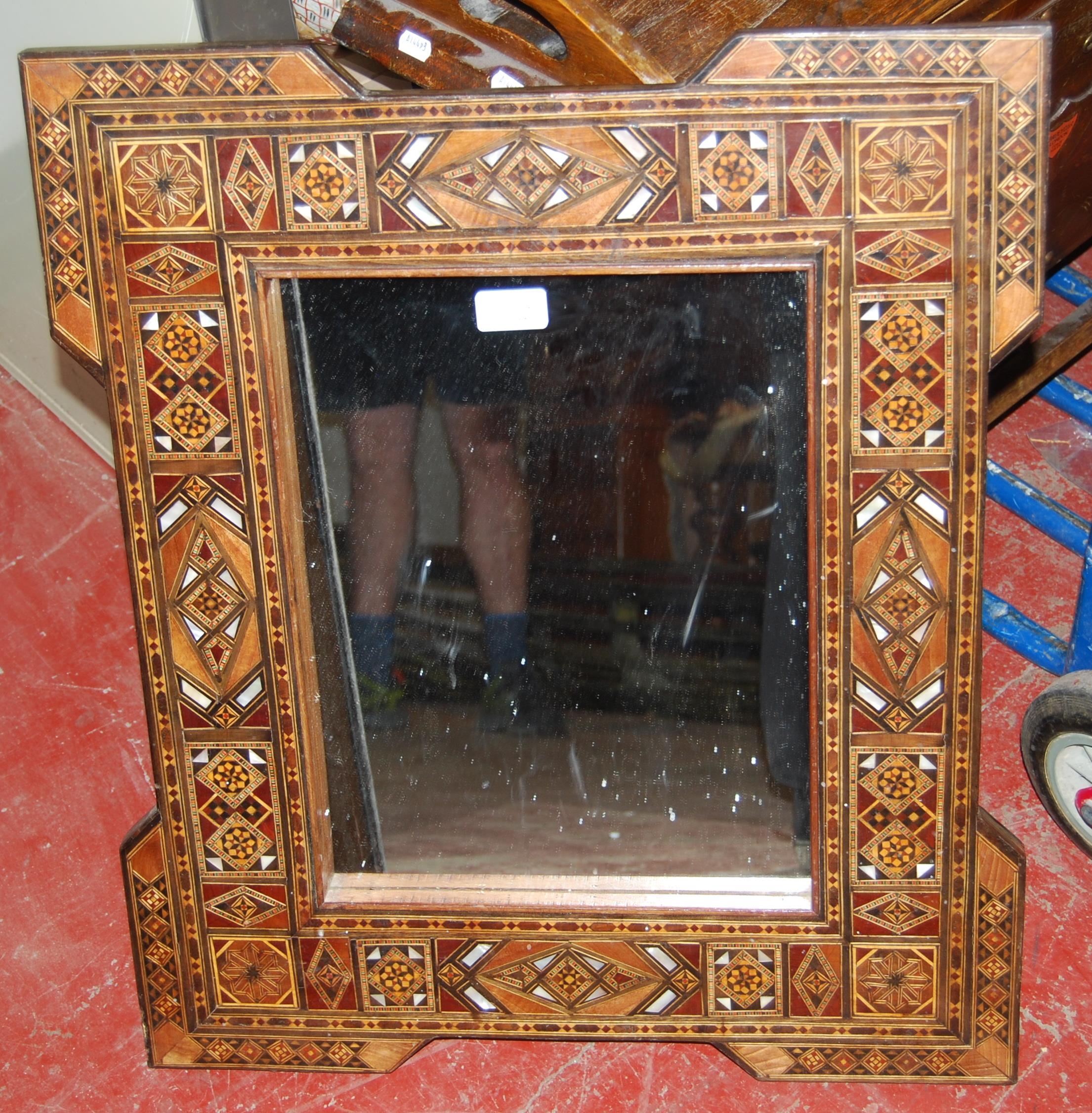 Antique Indo-Persian hardwood and marquetry inlaid wall mirror decorated all over with marquetry and