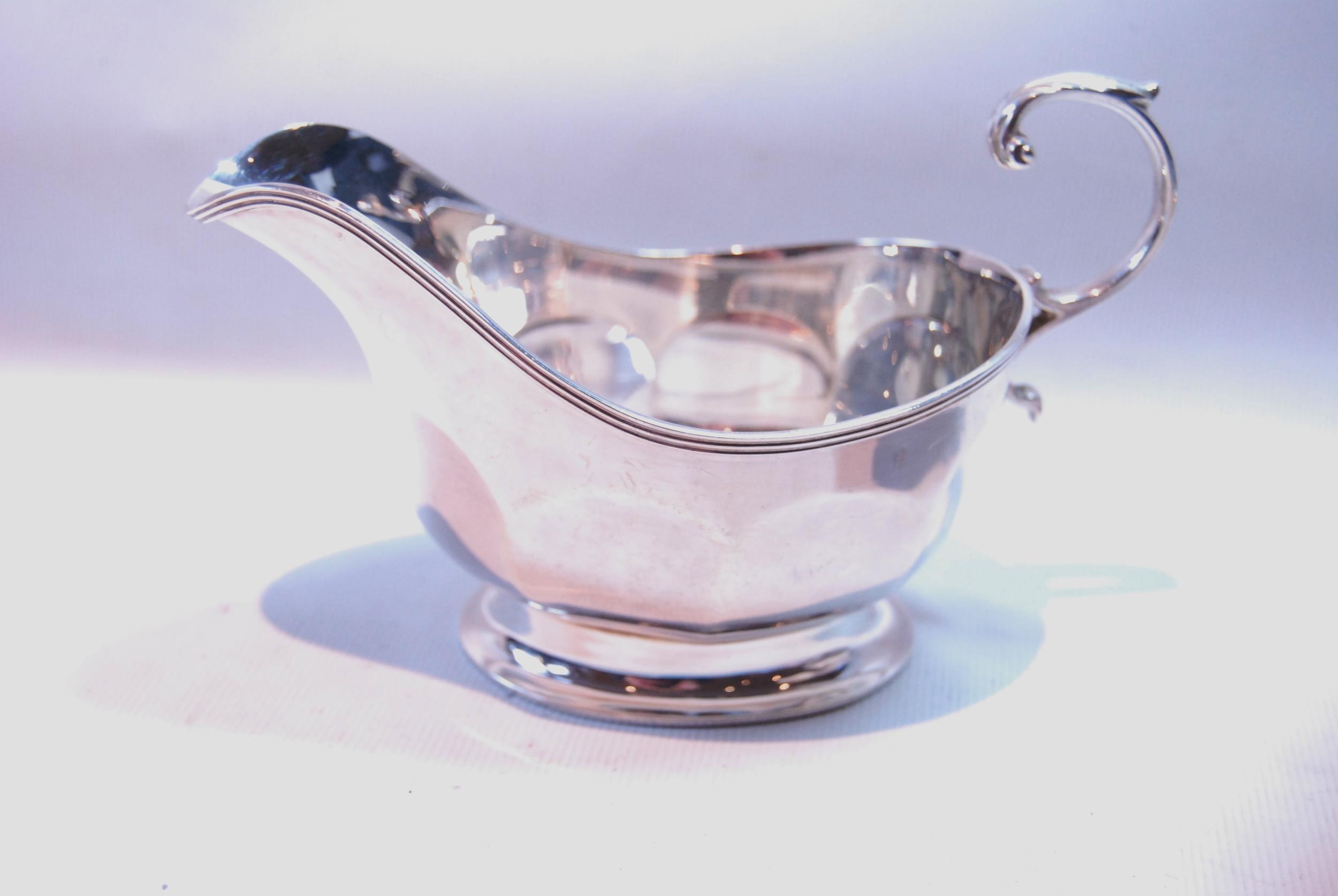 Silver sauce boat with cut edge on pad feet, and another, panelled oval, both by Adie Brothers, - Image 2 of 5