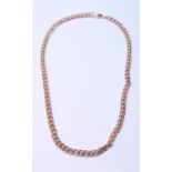 9ct gold necklet of tied curb pattern, 56cm long, 62g.