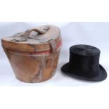 Black silk top hat retailed by Dunn & Co., Strand, London, internal diameter 15.5cm x 19.5cm, with